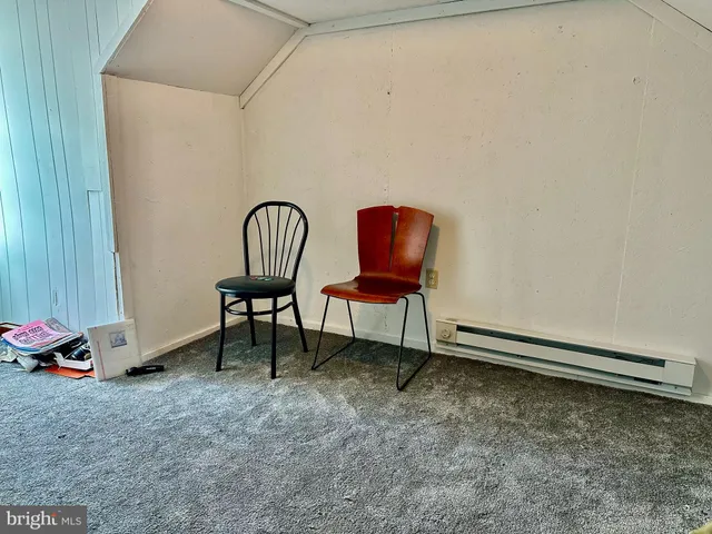 a workspace with furniture and a window