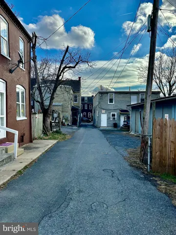 a view of a car park in front of house