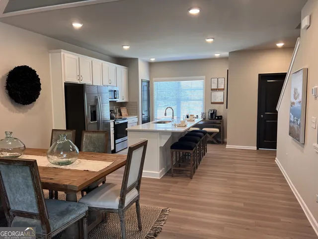 a view of a dining room with furniture