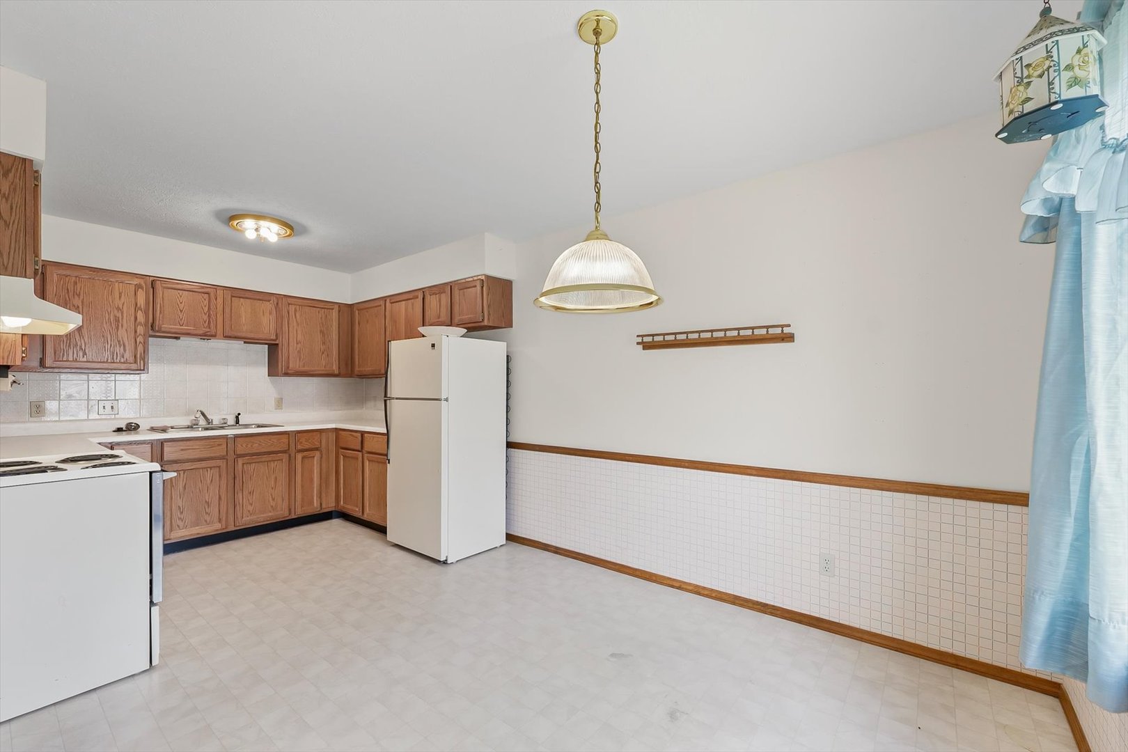 2016 Tracy Drive, Unit 3 Saybrook, IL 61770 - Photo 13 of 29 a kitchen with a refrigerator a stove and a sink