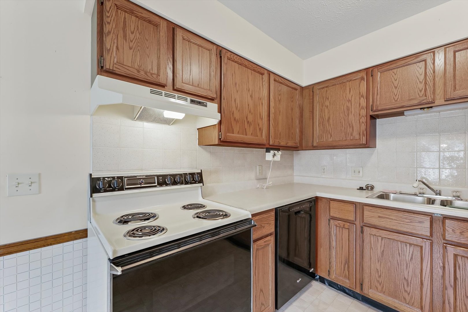 2016 Tracy Drive, Unit 3 Saybrook, IL 61770 - Photo 15 of 29 a kitchen with a sink stove and cabinets
