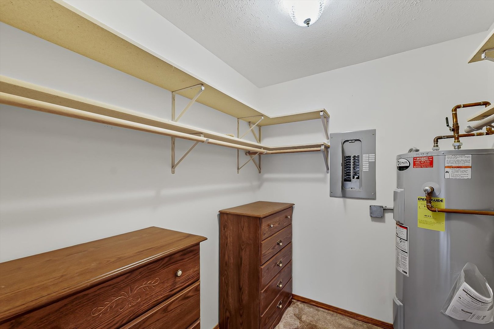 2016 Tracy Drive, Unit 3 Saybrook, IL 61770 - Photo 21 of 29 a view of storage and utility room with racks on the wall