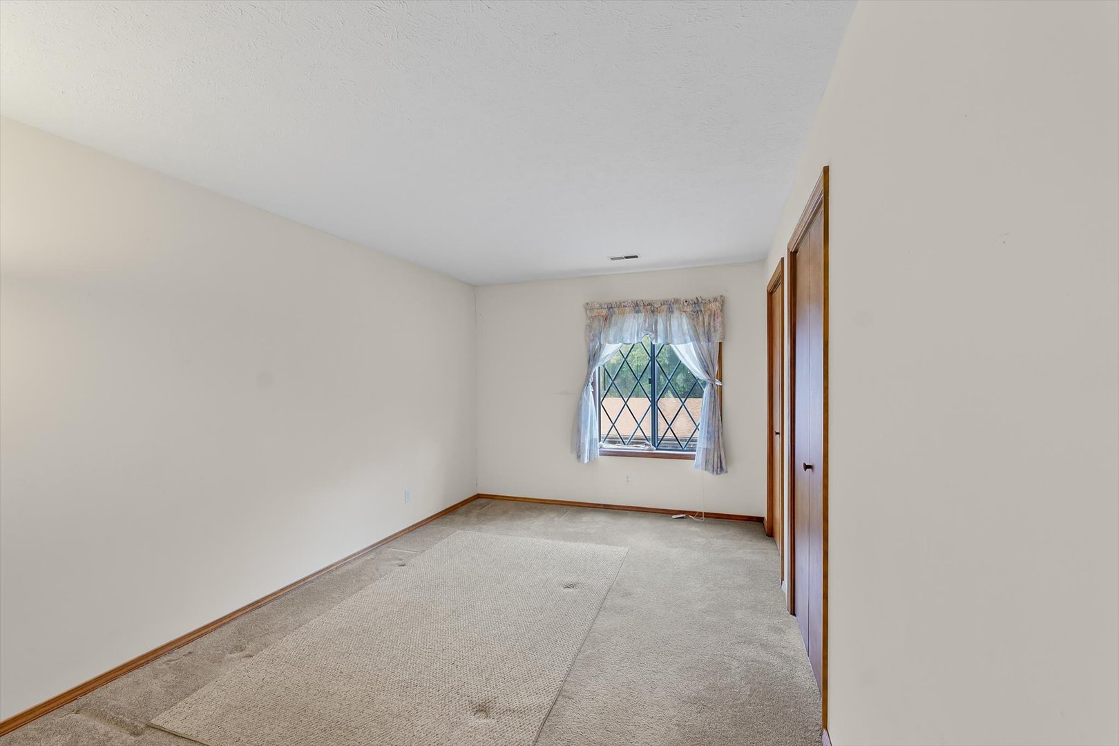 2016 Tracy Drive, Unit 3 Saybrook, IL 61770 - Photo 22 of 29 a view of an empty room with a window