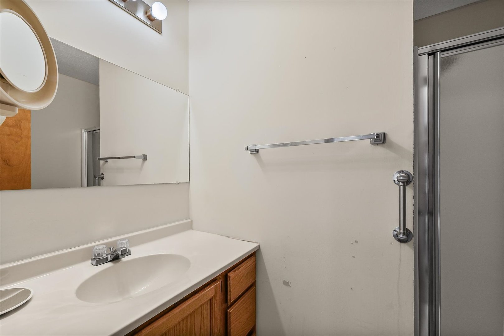 2016 Tracy Drive, Unit 3 Saybrook, IL 61770 - Photo 24 of 29 a bathroom with a sink and a mirror