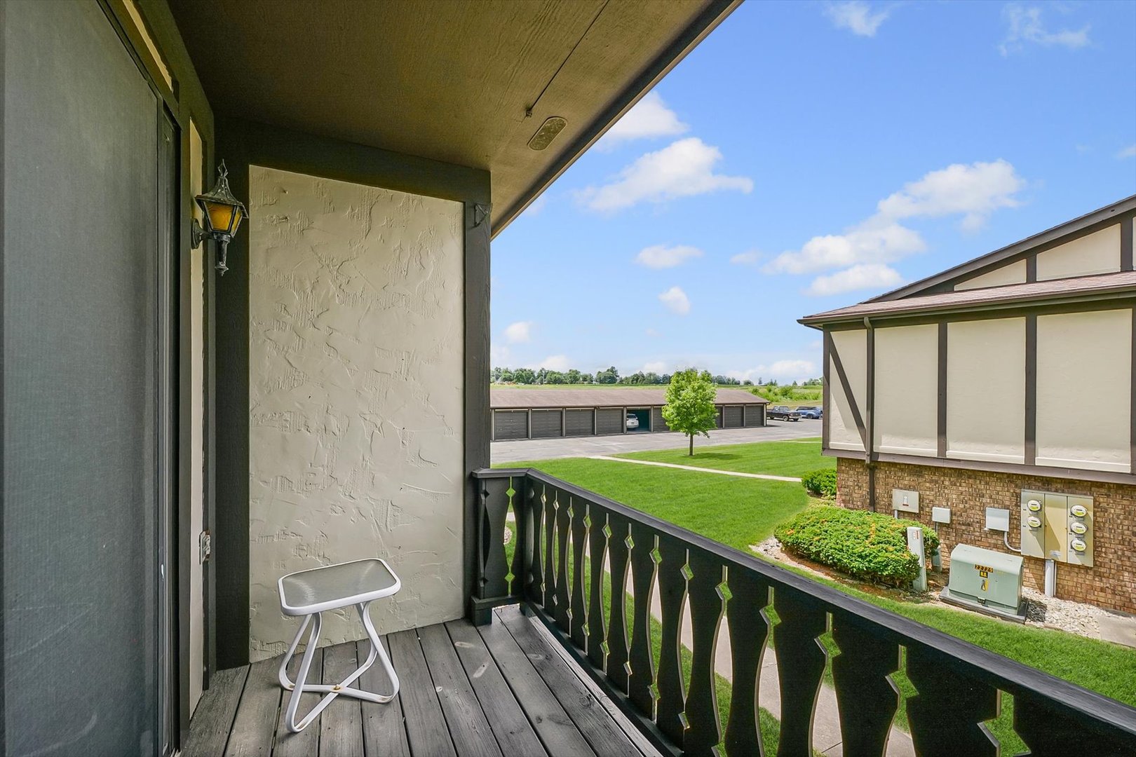 2016 Tracy Drive, Unit 3 Saybrook, IL 61770 - Photo 25 of 29 a view of a balcony with wooden floor and outdoor seating