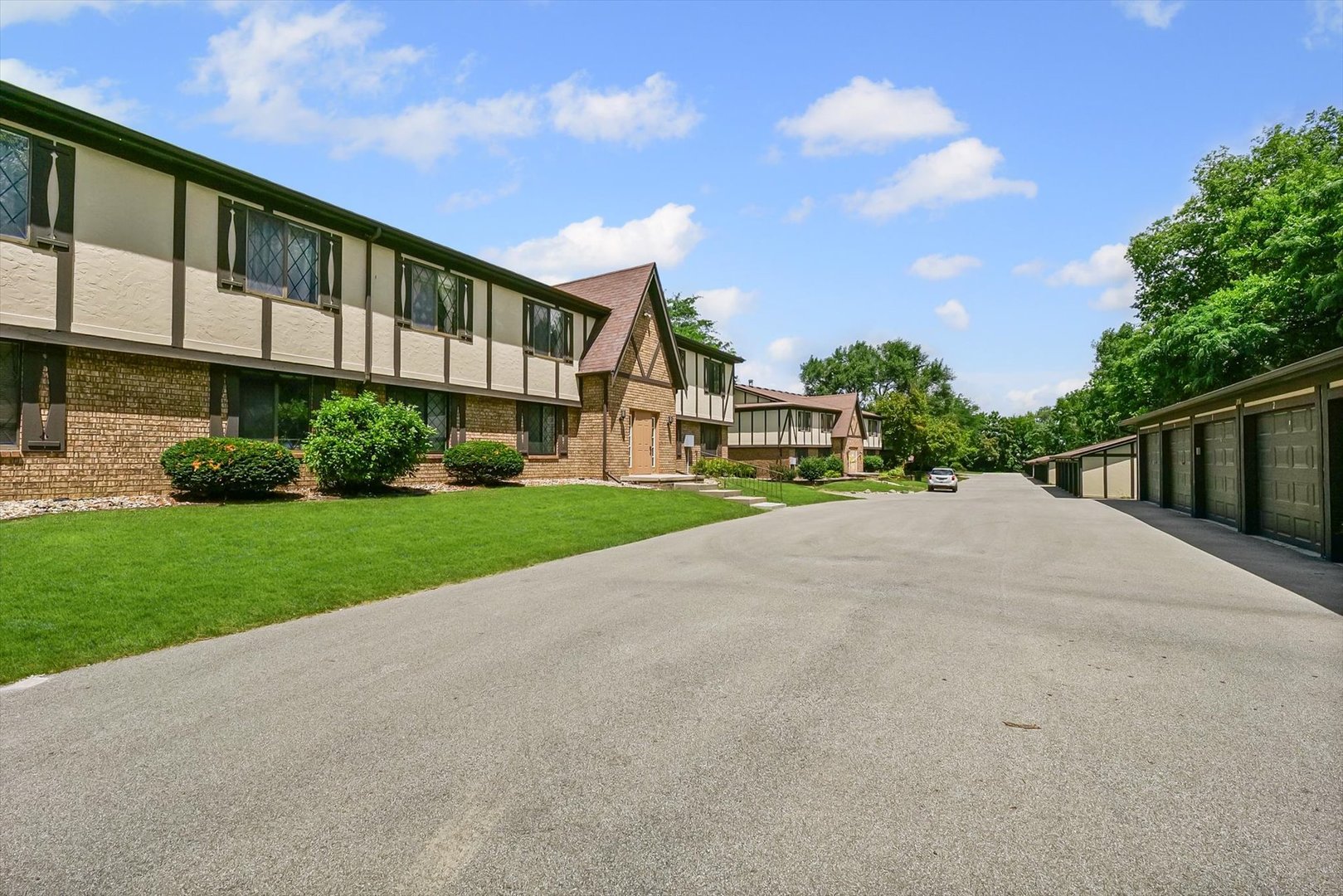 2016 Tracy Drive, Unit 3 Saybrook, IL 61770 - Photo 28 of 29 a view of a house with a big yard and large trees