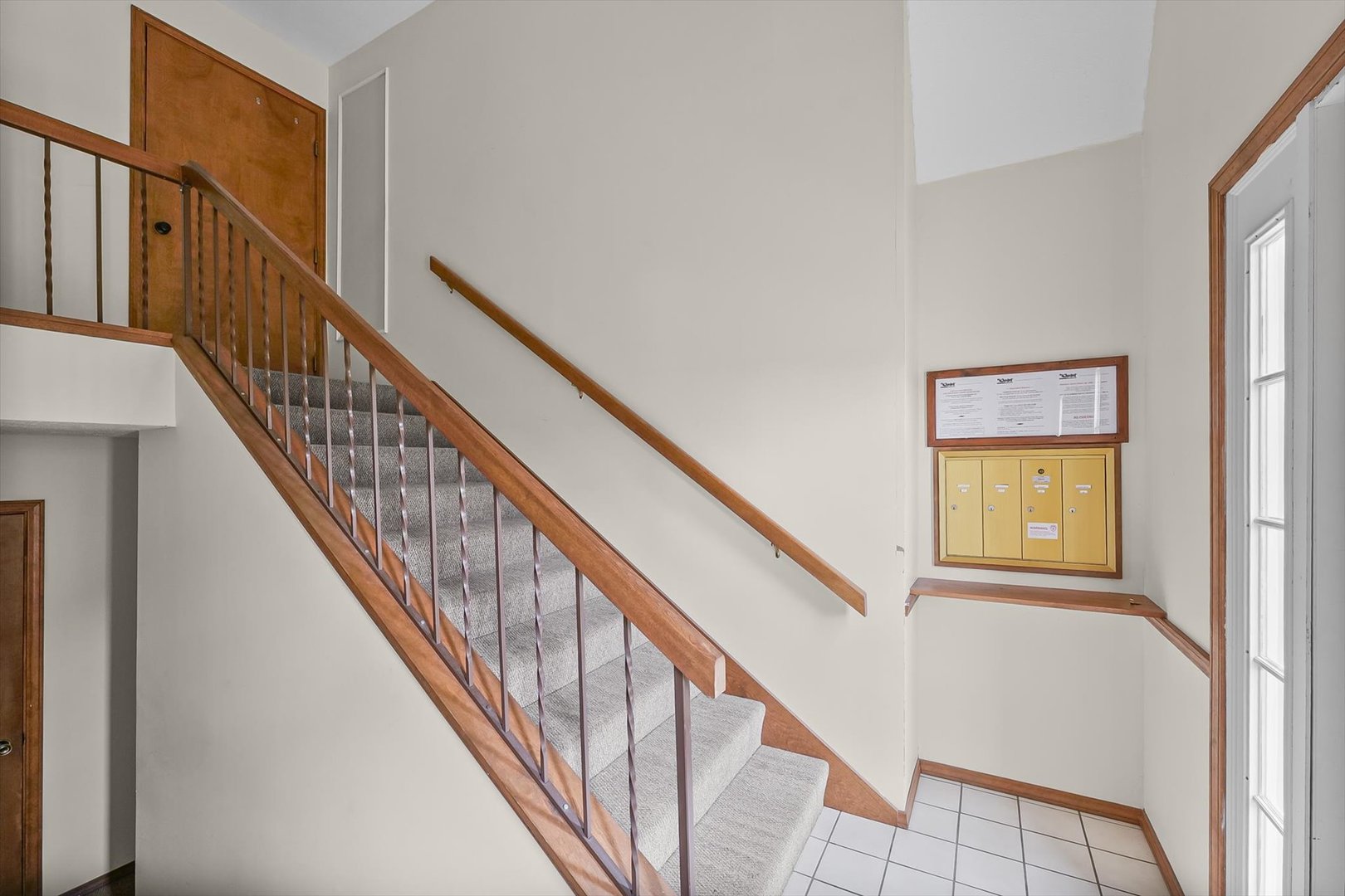 2016 Tracy Drive, Unit 3 Saybrook, IL 61770 - Photo 4 of 29 a view of staircase with wooden floor and windows
