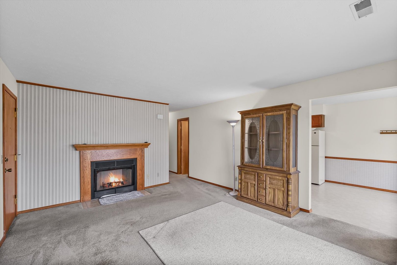2016 Tracy Drive, Unit 3 Saybrook, IL 61770 - Photo 8 of 29 a view of an empty room with fireplace and a window