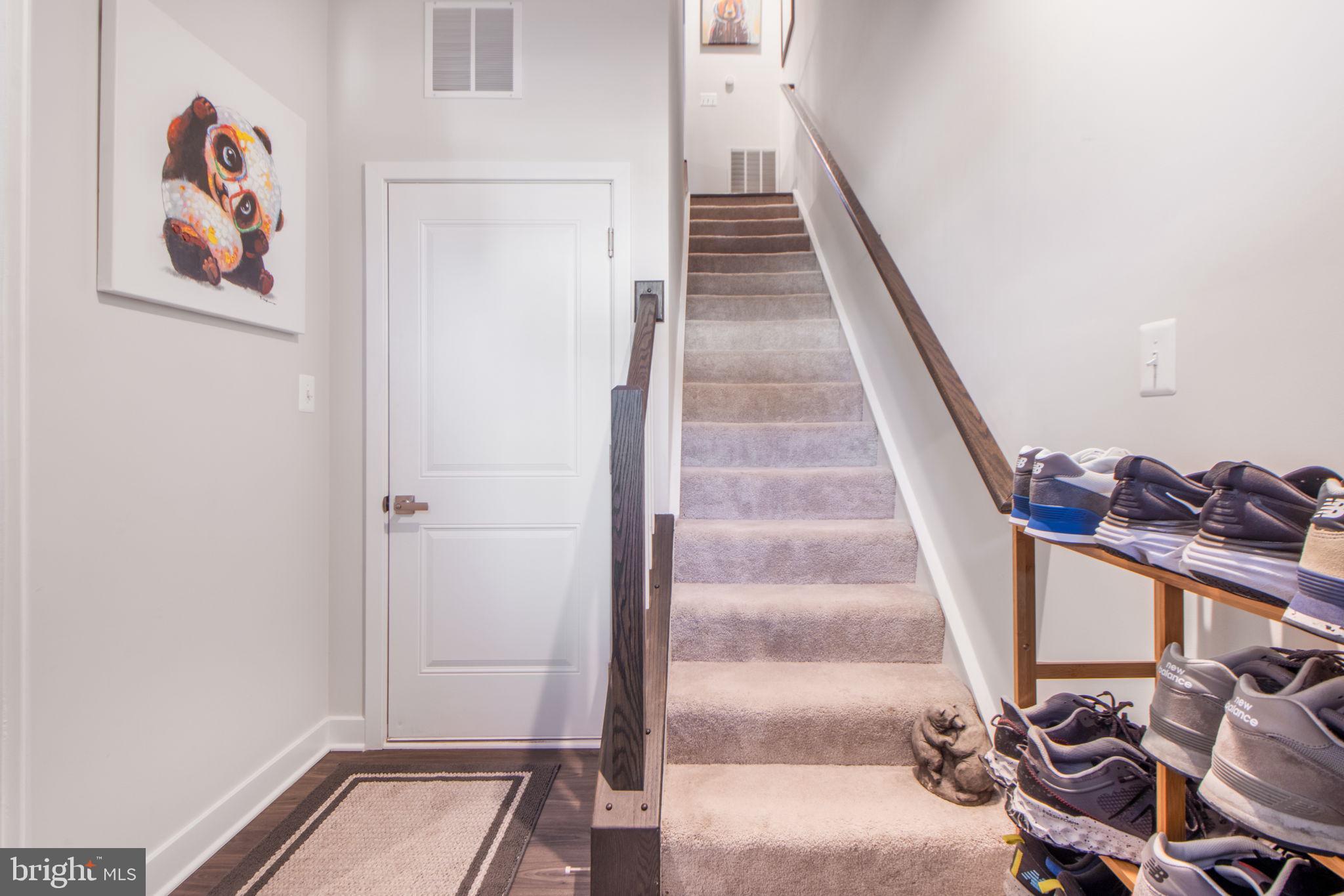 7105 Sollers Point Road Dundalk, MD 21222 - Photo 31 of 31 a view of a hallway with wooden floor and entryway