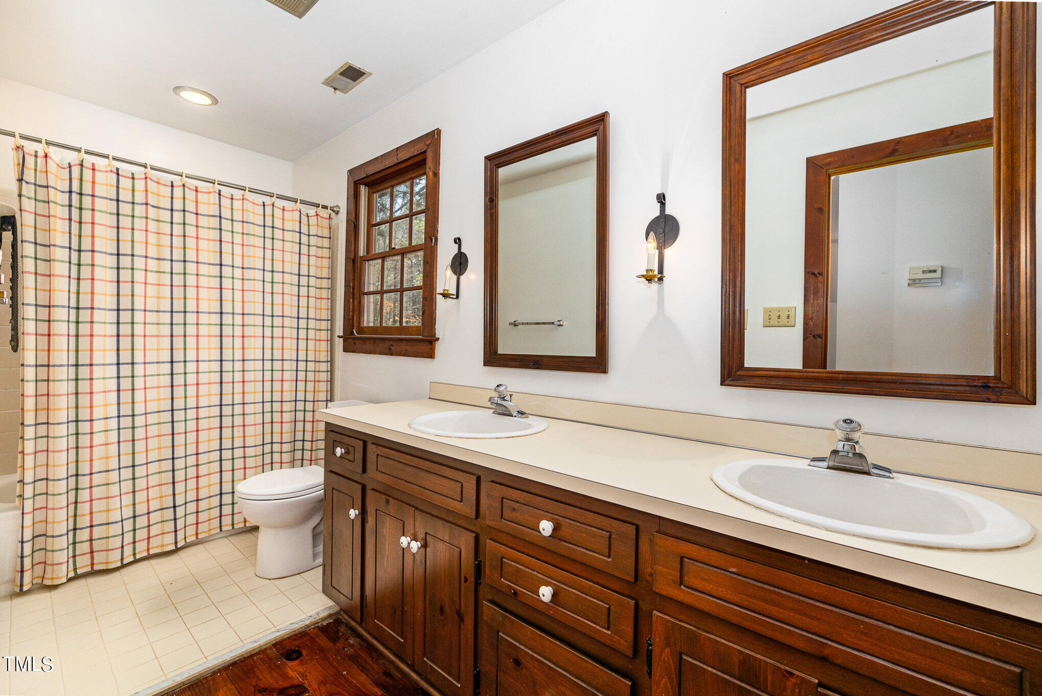 7825 Netherlands Drive Raleigh, NC 27606 - Photo 18 of 33 Upstairs Bathroom