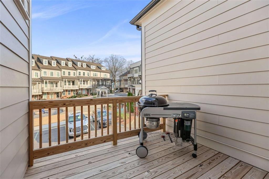 4466 Lemon Street Acworth, GA 30101 - Photo 51 of 65 a view of balcony with wooden floor and outdoor seating