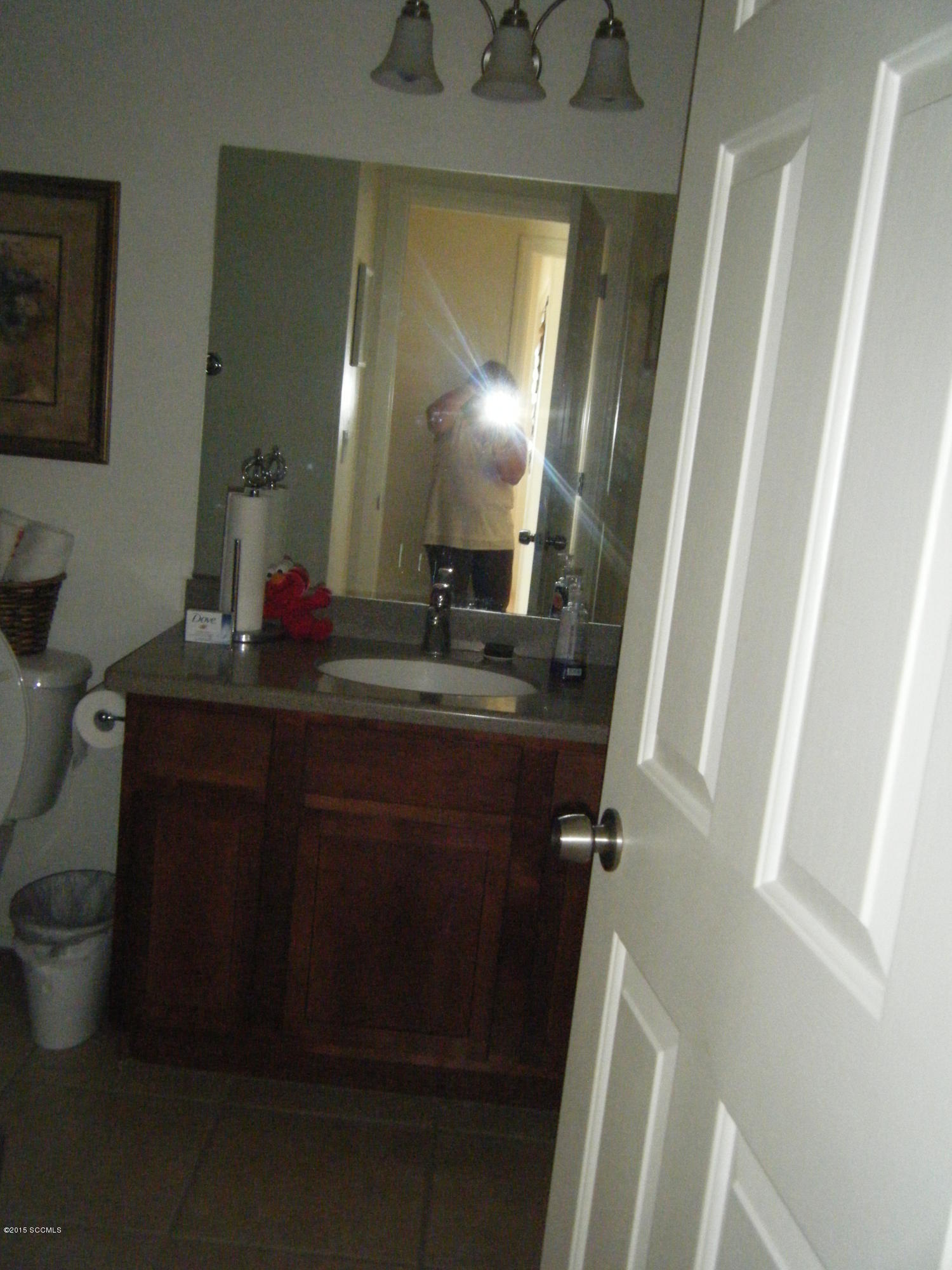 187 Camino Oceano Rio Rico, AZ 85648 - Photo 7 of 23 a bathroom with a sink vanity and a mirror
