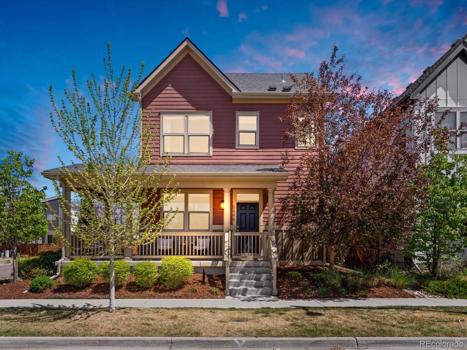 5446 Uinta Way Denver, CO 80238 - Photo 1 of 49 a front view of a house with garden