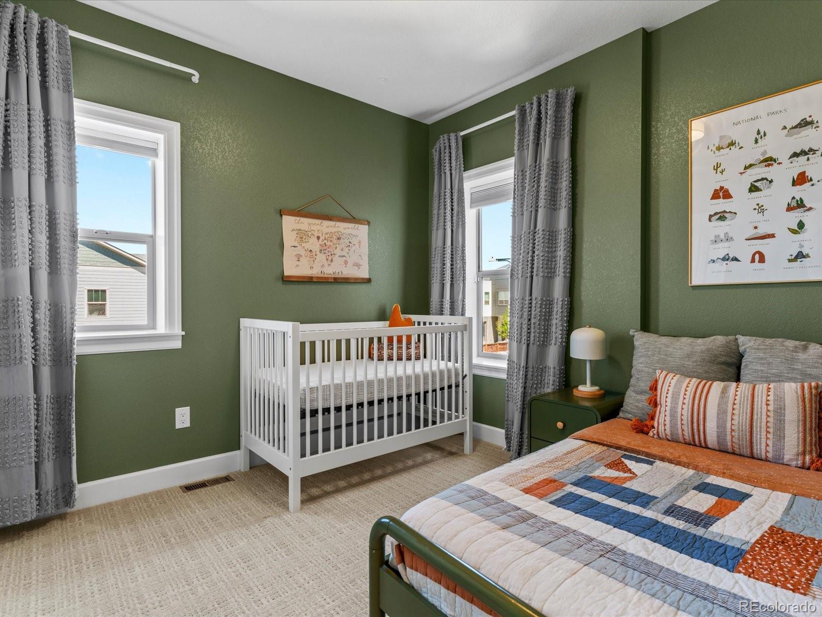 5446 Uinta Way Denver, CO 80238 - Photo 23 of 49 a bedroom with a bed and a window