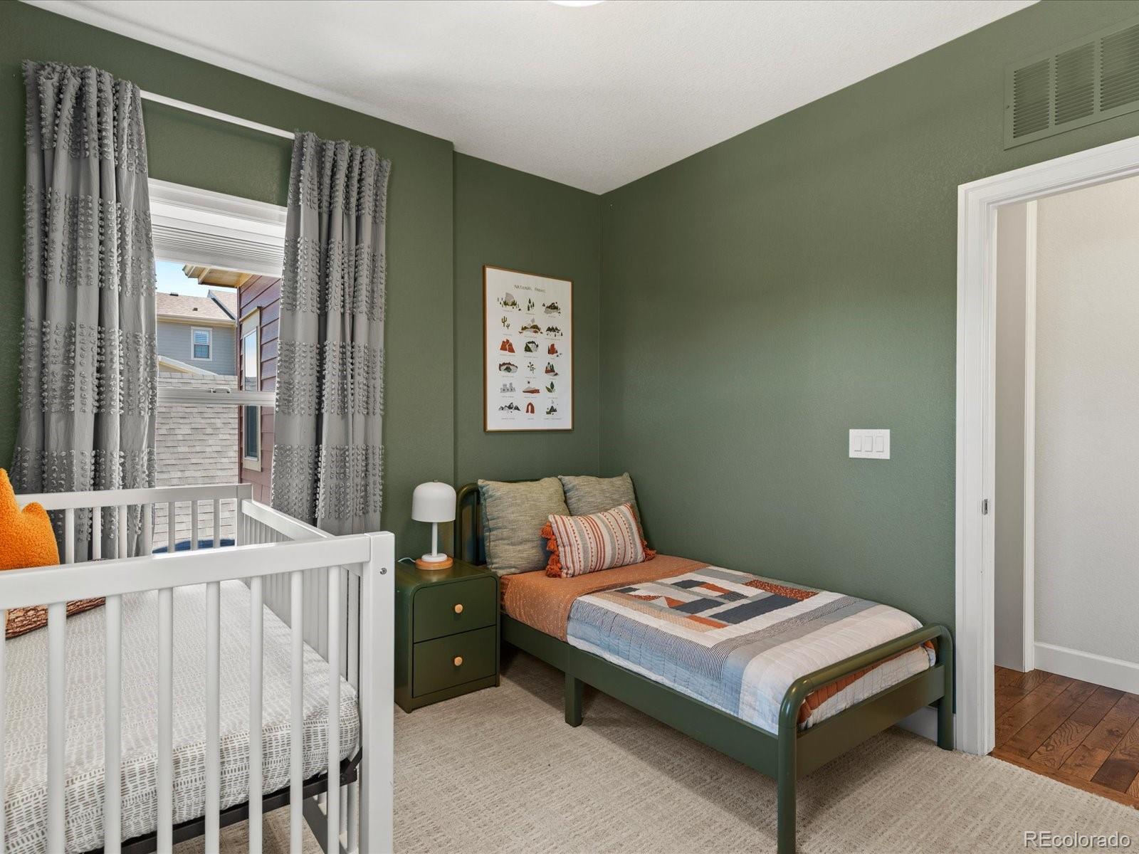 5446 Uinta Way Denver, CO 80238 - Photo 24 of 49 a bedroom with a bed and a table