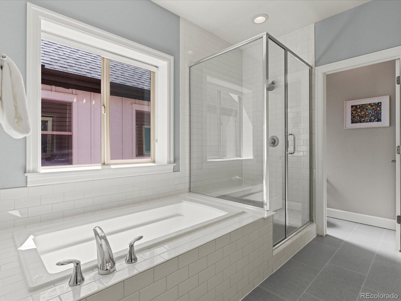 5446 Uinta Way Denver, CO 80238 - Photo 30 of 49 a bathroom with a bathtub and a sink