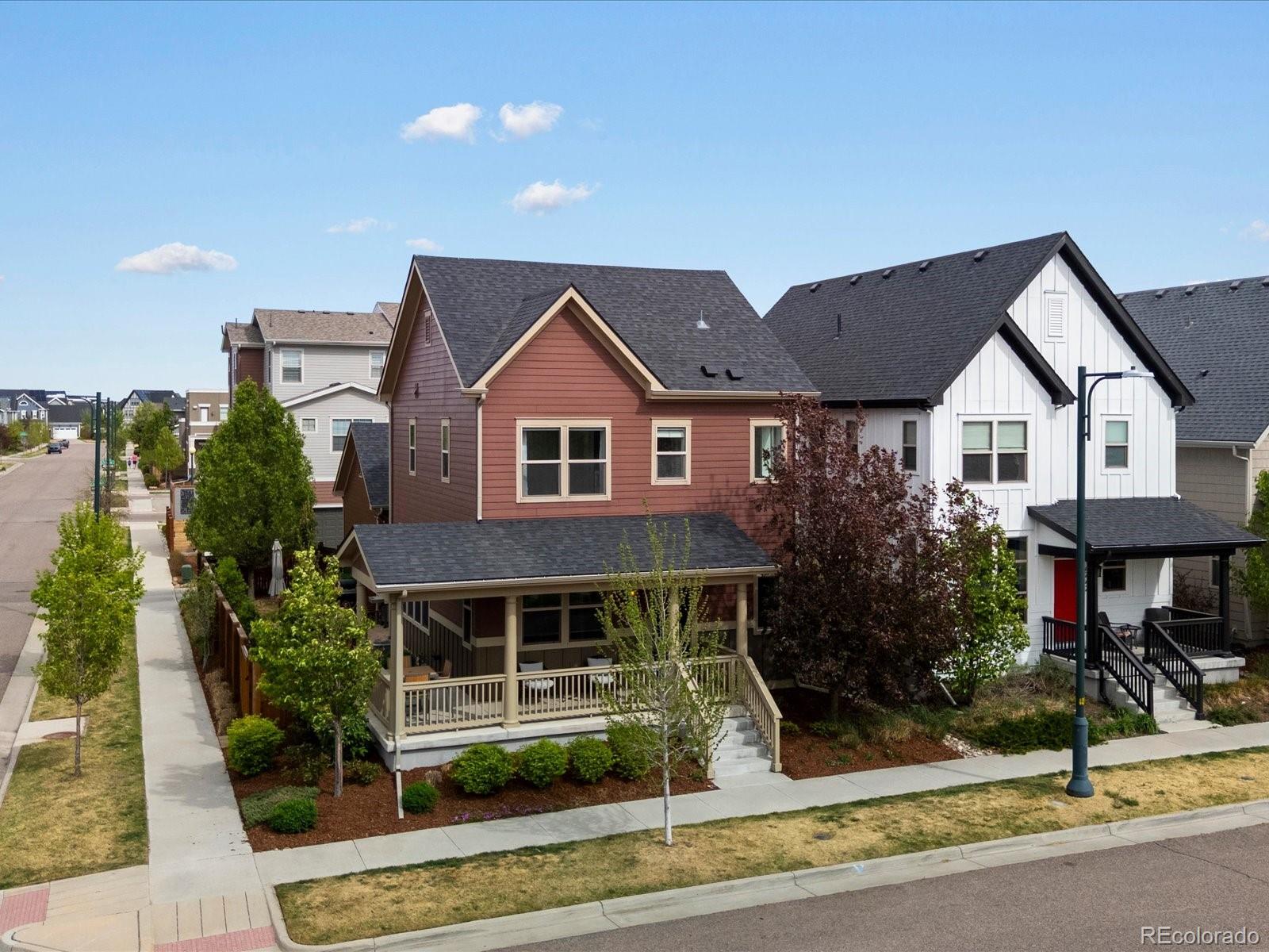 5446 Uinta Way Denver, CO 80238 - Photo 3 of 49 a front view of a house with garden
