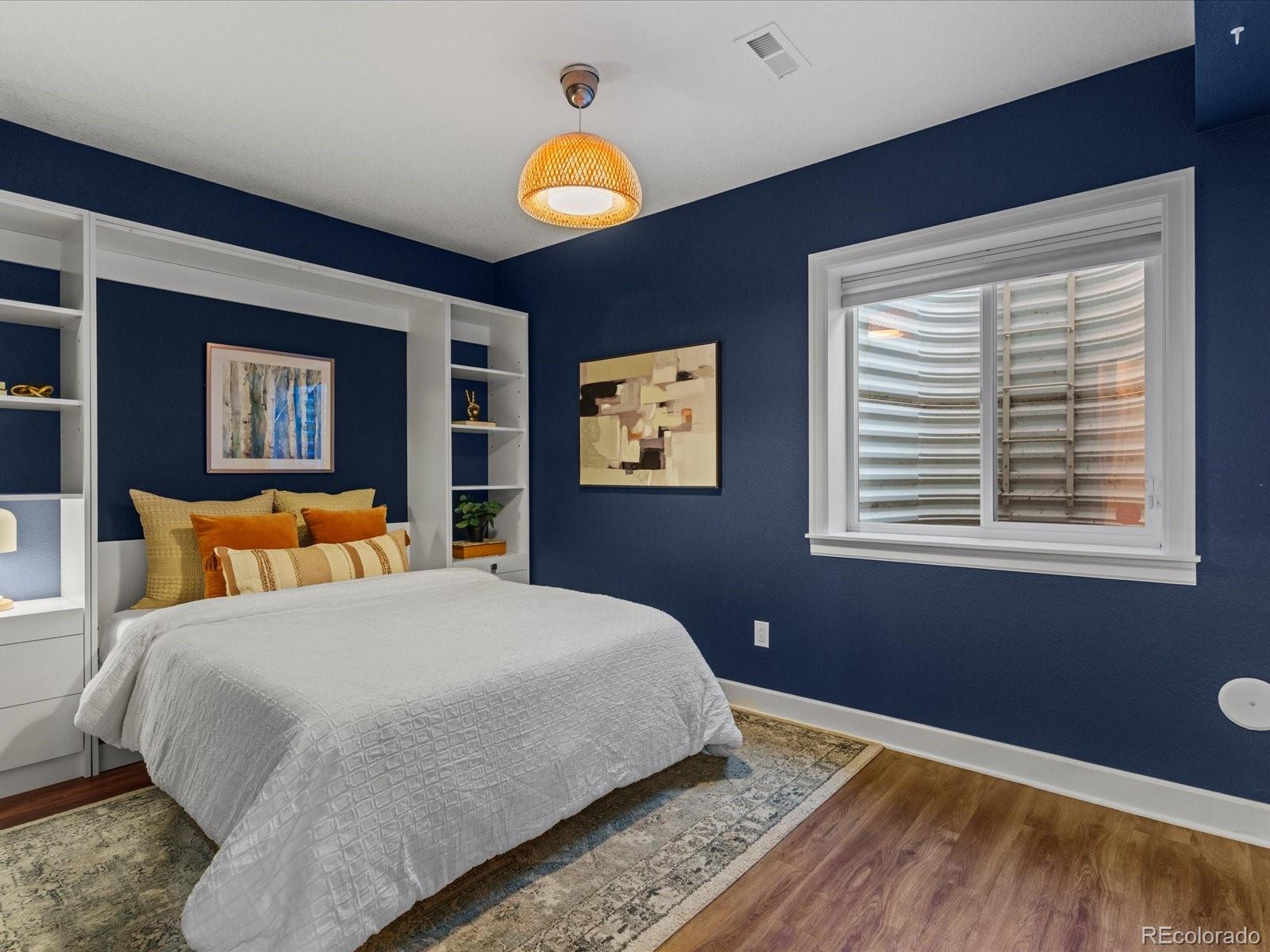 5446 Uinta Way Denver, CO 80238 - Photo 36 of 49 a bedroom with a bed and a window