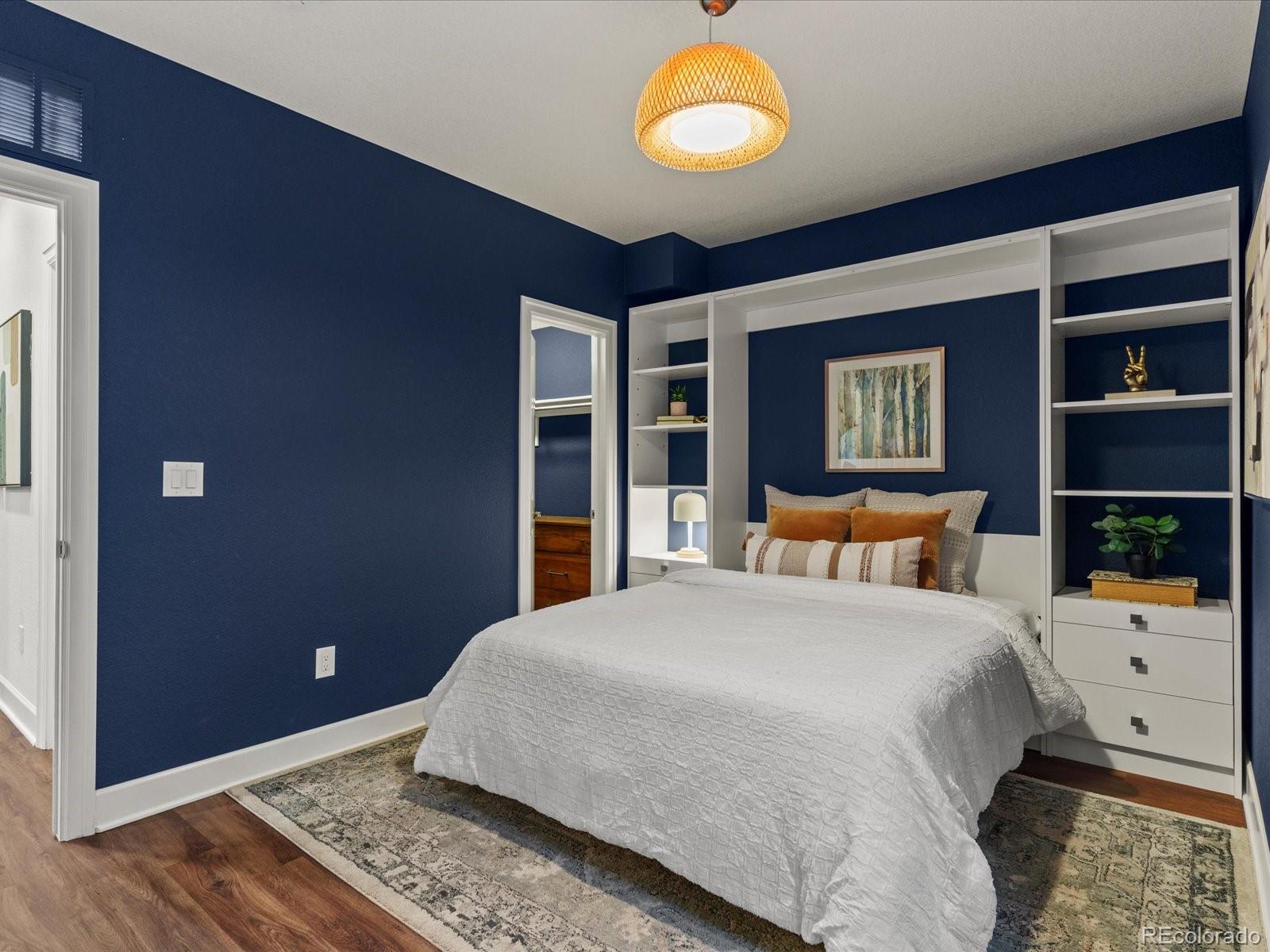 5446 Uinta Way Denver, CO 80238 - Photo 37 of 49 a bedroom with a bed and a large window