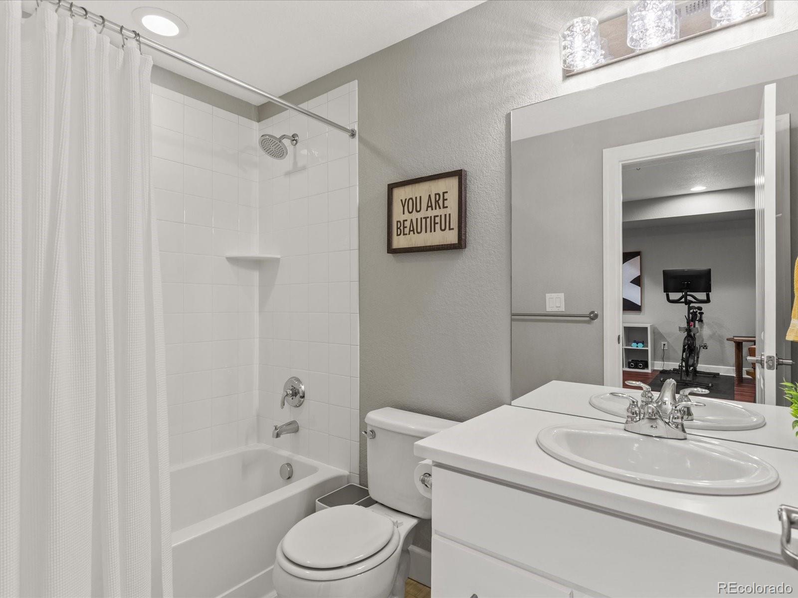 5446 Uinta Way Denver, CO 80238 - Photo 38 of 49 a bathroom with a sink toilet and shower