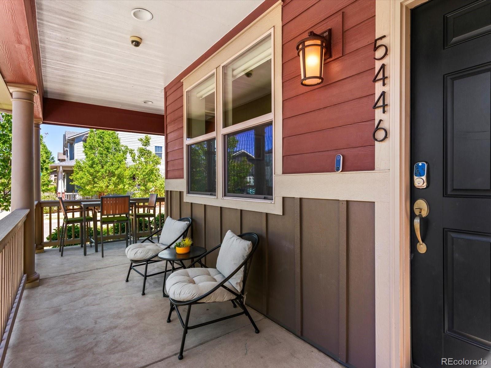 5446 Uinta Way Denver, CO 80238 - Photo 4 of 49 a balcony view with a sink and chairs