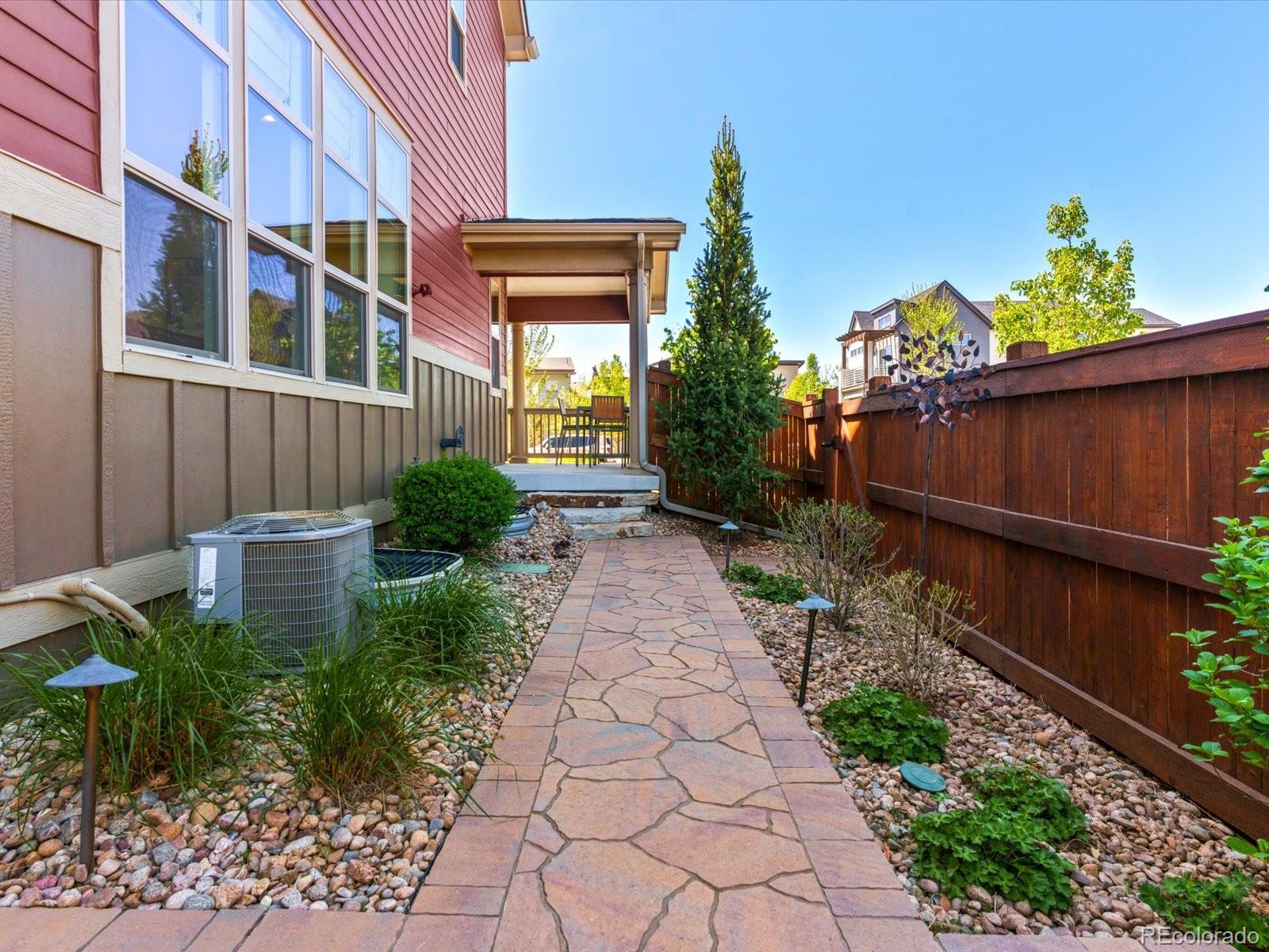 5446 Uinta Way Denver, CO 80238 - Photo 42 of 49 a view of a pathway with a garden