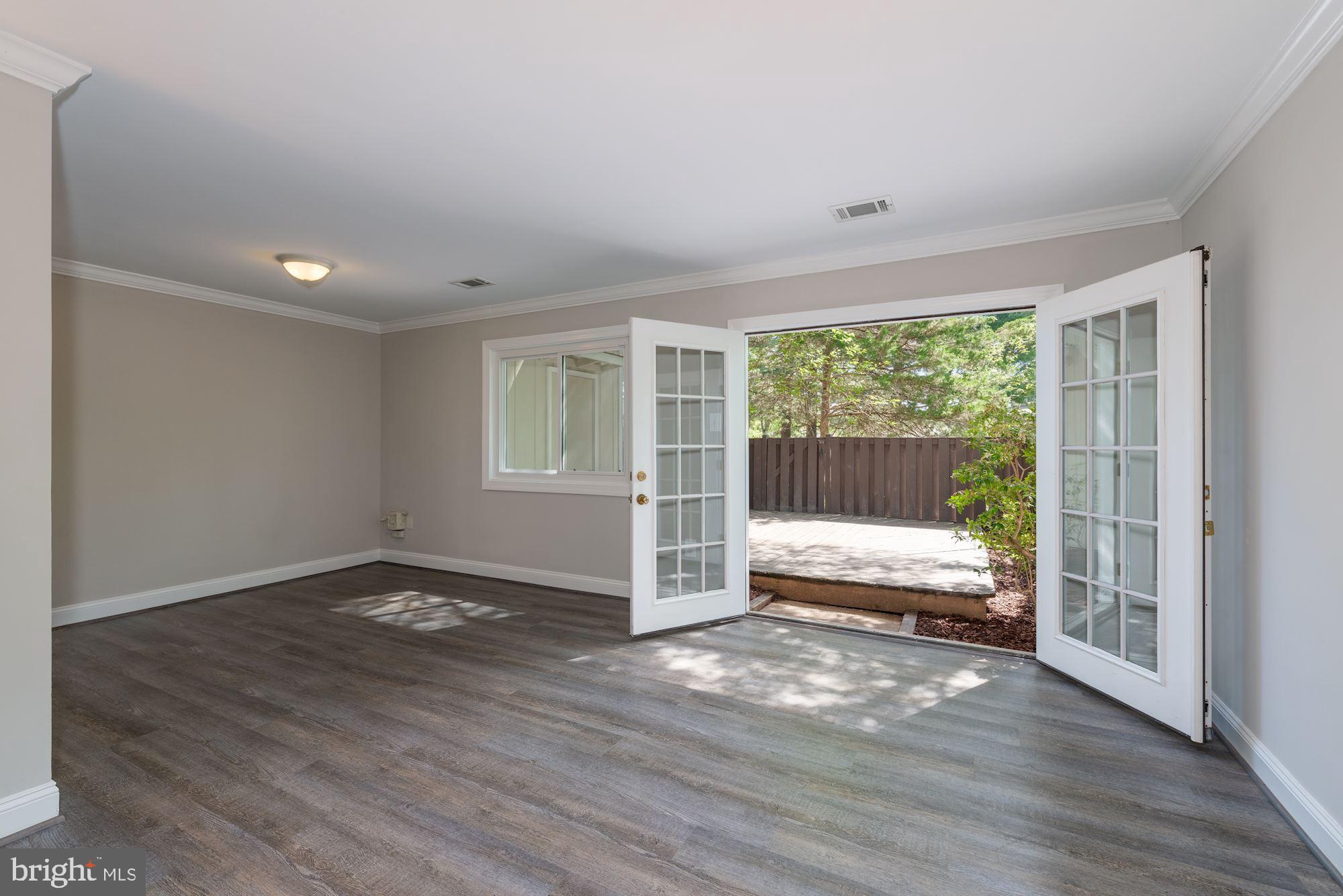 219 North Cottage Road Sterling, VA 20164 - Photo 9 of 21 Double doors open to private rear yard