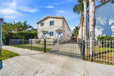 a front view of a house with tree s