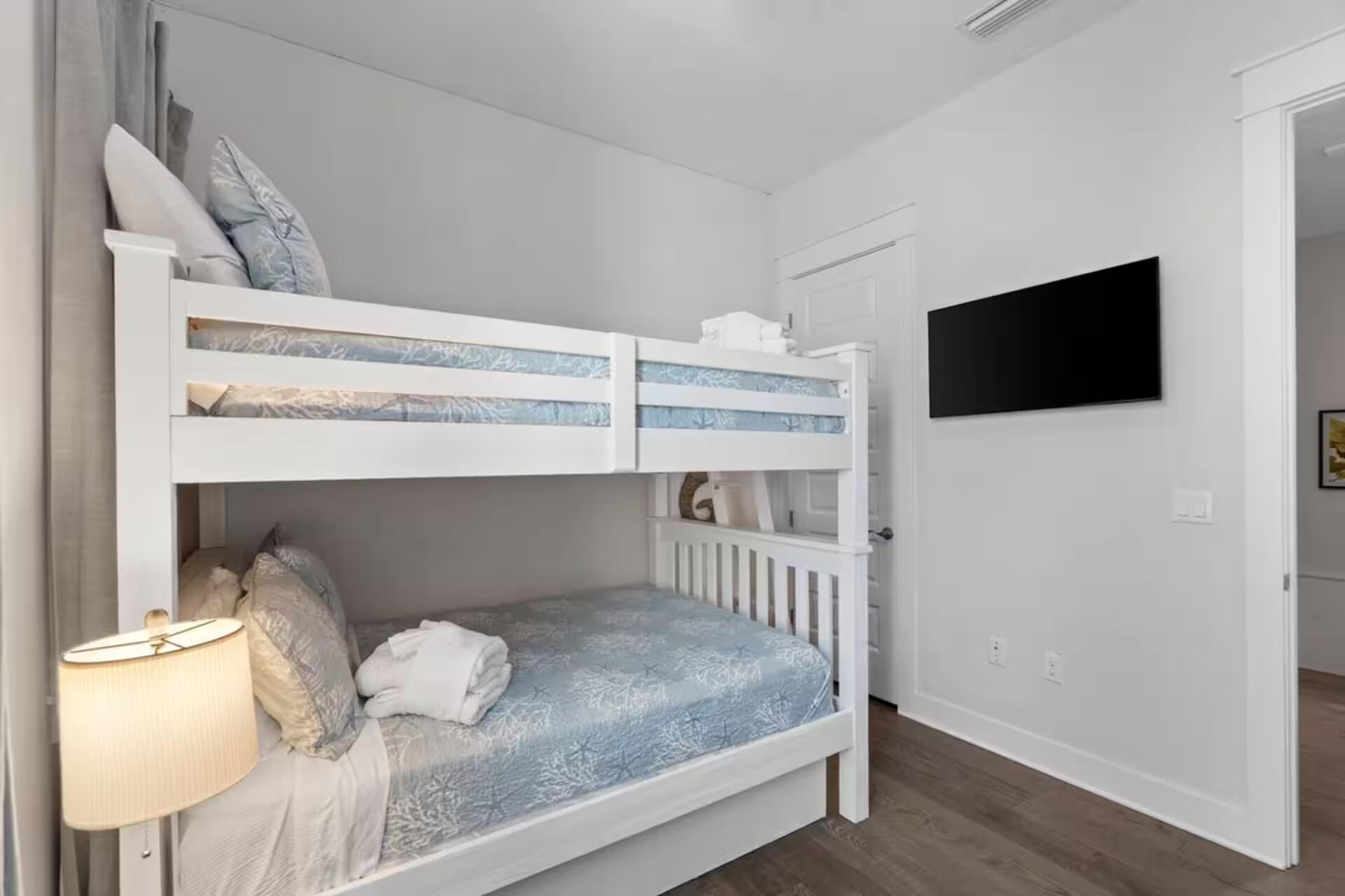 146 East E Pine, Unit B Inlet Beach, FL 32461 - Photo 21 of 47 a bedroom with a bed and a flat screen tv