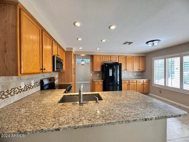 a view of a hallway with furniture and front door