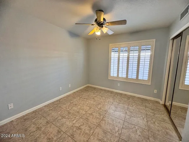a view of a hallway with entryway and stairs