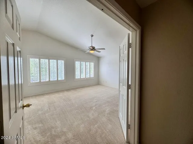 a view of an empty room with a window