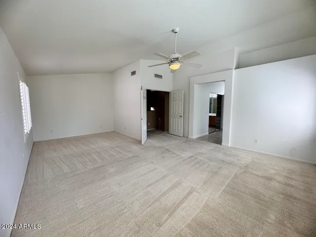 a view of empty room with cabinet