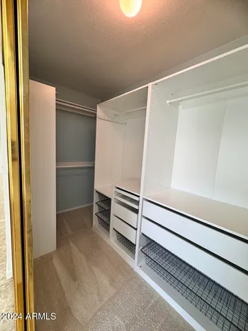 a view of a kitchen cabinets and a wooden floor