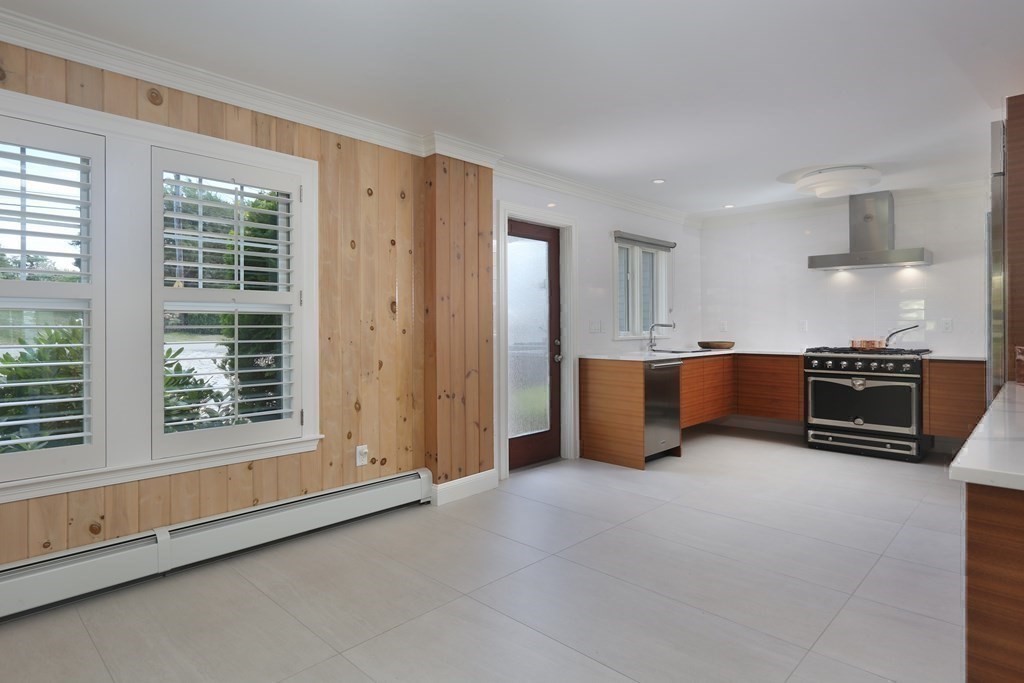 11 Bryant Road Bourne, MA 02532 - Photo 12 of 28 a view of an empty room with a kitchen and a window
