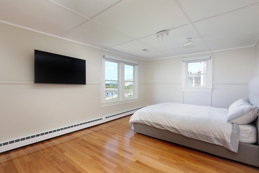 11 Bryant Road Bourne, MA 02532 - Photo 17 of 28 a bedroom with a bed and a flat screen tv