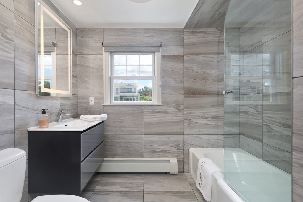 11 Bryant Road Bourne, MA 02532 - Photo 21 of 28 a bathroom with a sink a toilet and bathtub