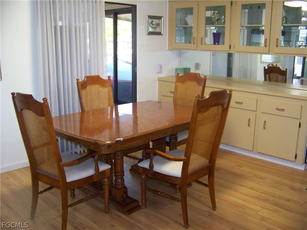 15550 Burnt Store Road, Unit 72 Punta Gorda, FL 33955 - Photo 21 of 50 a view of a dining room with furniture and window