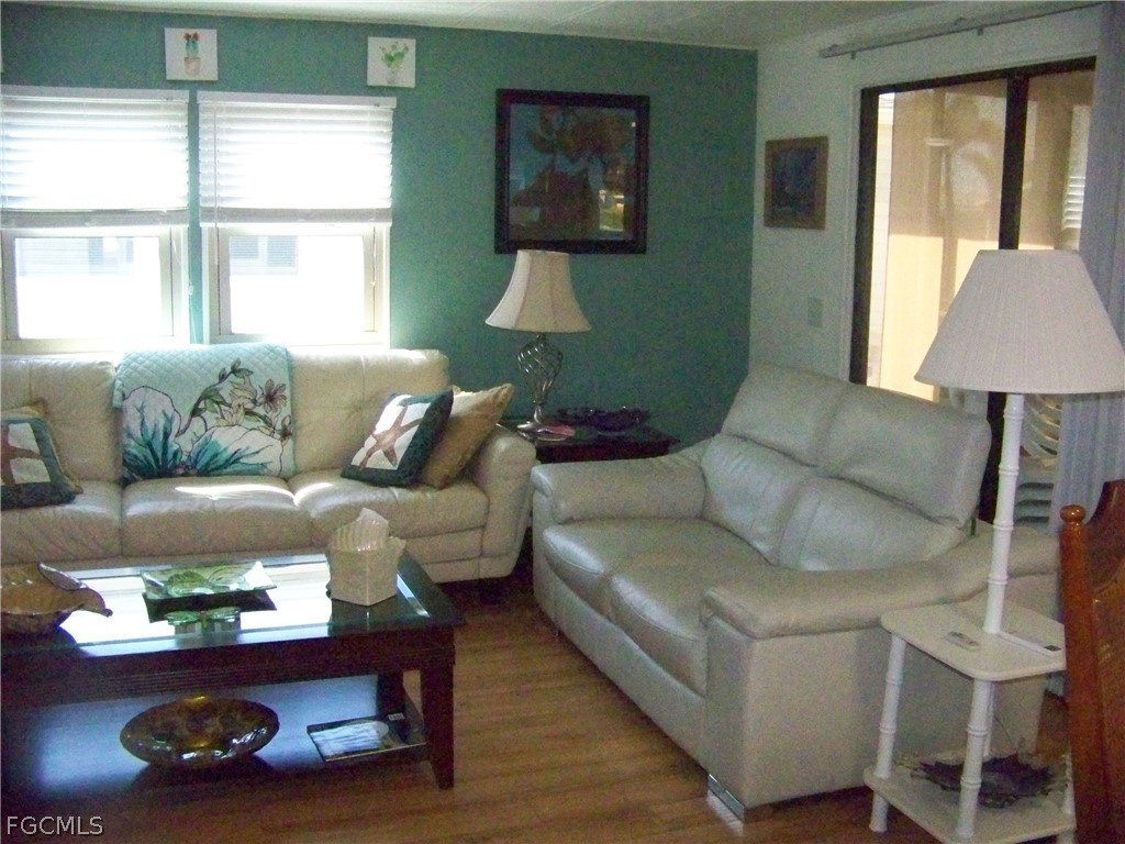 15550 Burnt Store Road, Unit 72 Punta Gorda, FL 33955 - Photo 25 of 50 a living room with furniture and a window