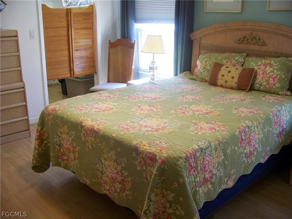 15550 Burnt Store Road, Unit 72 Punta Gorda, FL 33955 - Photo 29 of 50 a spacious bedroom with a bed and a window