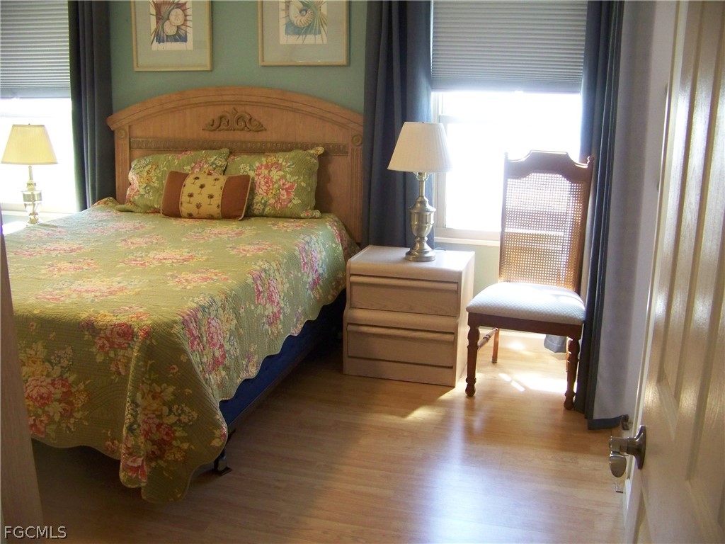 15550 Burnt Store Road, Unit 72 Punta Gorda, FL 33955 - Photo 30 of 50 a spacious bedroom with a bed and window