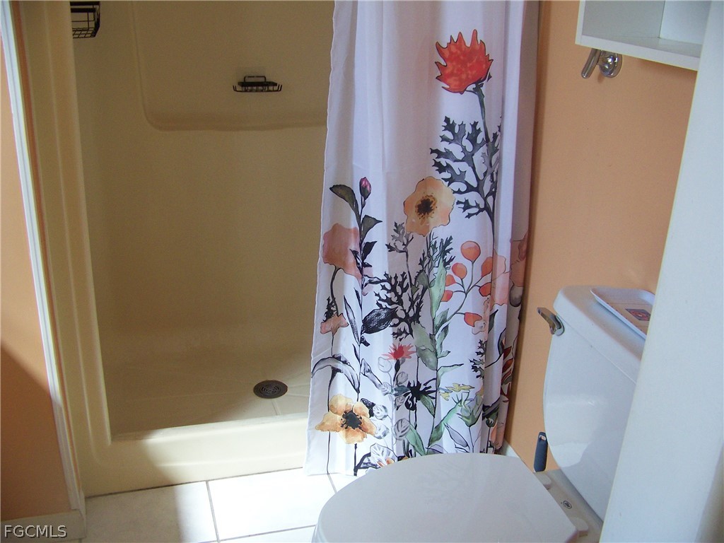 15550 Burnt Store Road, Unit 72 Punta Gorda, FL 33955 - Photo 34 of 50 a bathroom with a shower and a toilet
