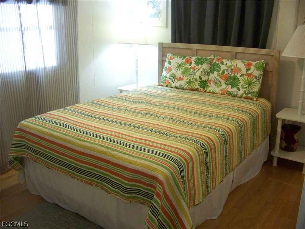 15550 Burnt Store Road, Unit 72 Punta Gorda, FL 33955 - Photo 36 of 50 a bedroom with a bed and window