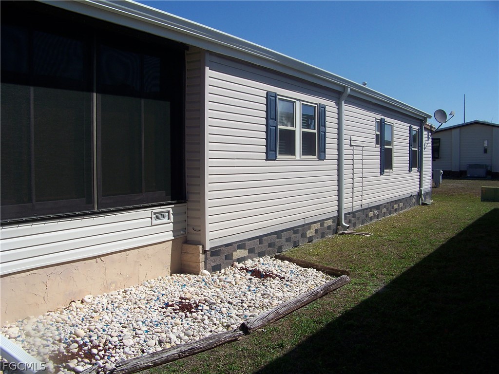 15550 Burnt Store Road, Unit 72 Punta Gorda, FL 33955 - Photo 4 of 50 a front view of house with yard