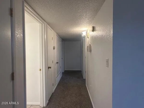 a view of a hallway with a lamp