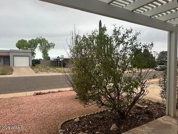 a view of a yard and front of house