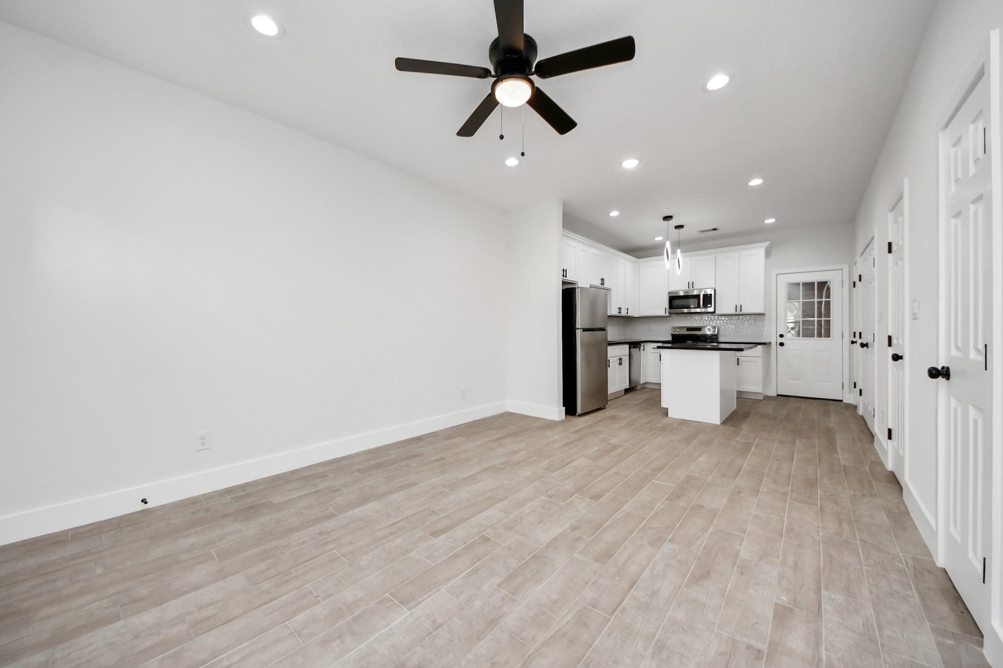 8015 Elbert Street, Unit A/B Houston, TX 77028 - Photo 3 of 12 a view of kitchen with wooden floor