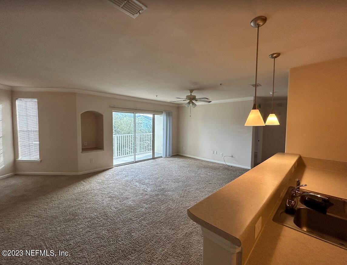 8290 Gate Parkway West, Unit 149 Jacksonville, FL 32216 - Photo 7 of 14 a view of a room with a ceiling fan
