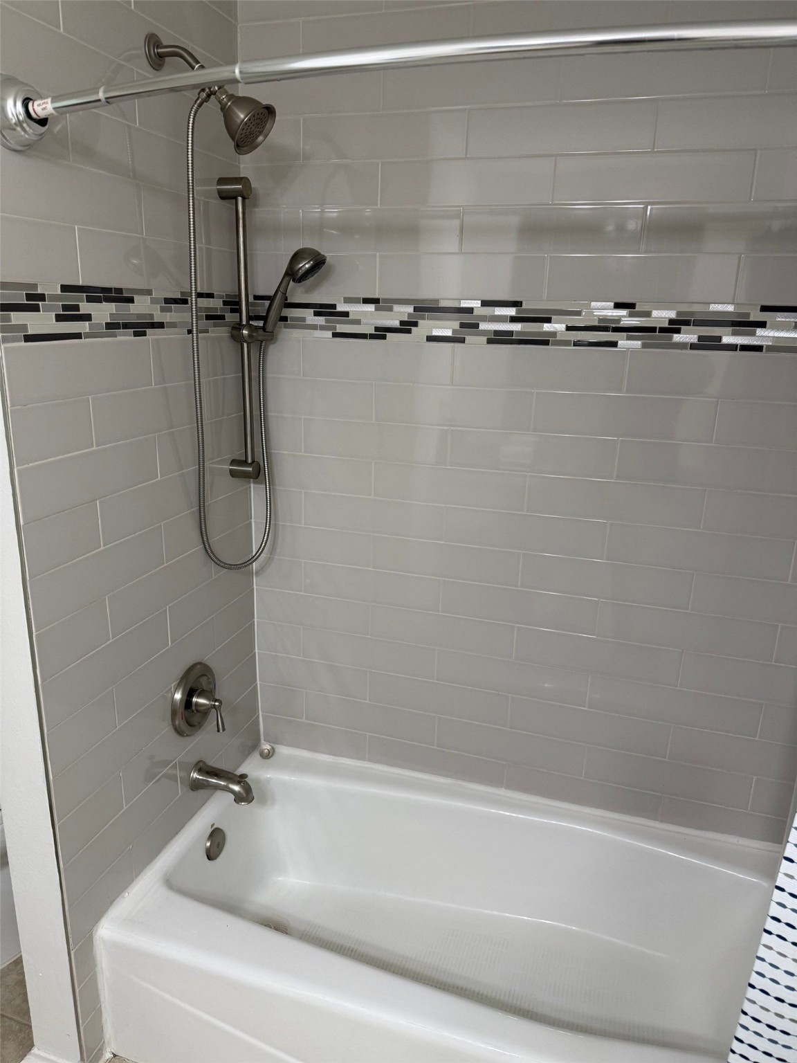 9626 Magnolia Ridge Drive Houston, TX 77070 - Photo 28 of 40 a bathroom with a shower and a bath tub