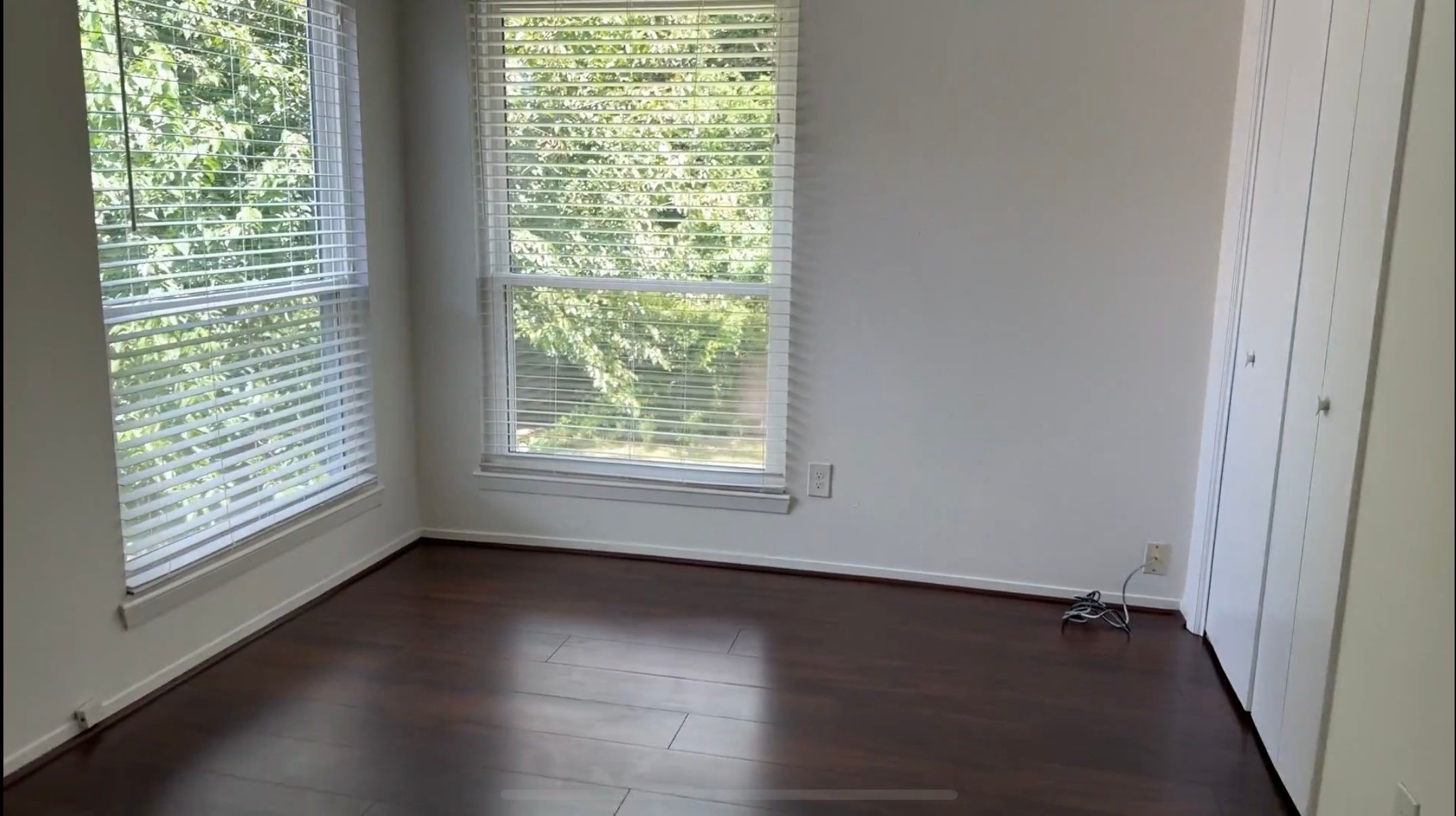 9626 Magnolia Ridge Drive Houston, TX 77070 - Photo 29 of 40 a view of an empty room with wooden floor and a window